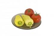 Tomatoes and bell peppers on a plate, isolated on white background. - Tomatoes and bell peppers