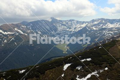 Looking down - View of a valley between the mountains